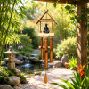 Carillon en bambou et Bouddha près d'un bassin zen pour ambiance relaxante au jardin