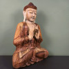 Bouddha de la transmission en bois de suar sculpté à la main, 60 cm, vu de trois-quarts, visage vers la droite